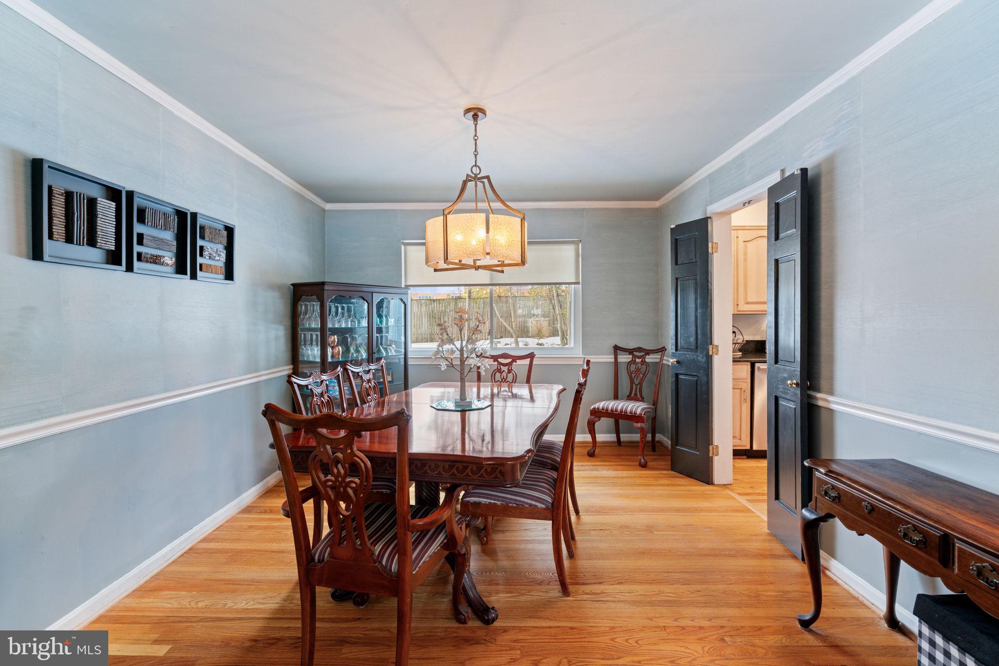 6102 Sherborn Lane Springfield, VA 22152 - Photo 10 of 51 a view of a dining room with furniture window and wooden floor