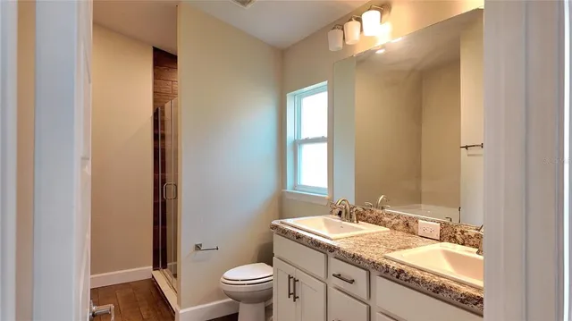 a view of a bathroom from a hallway