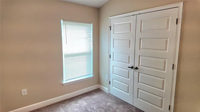 a bathroom with a granite countertop toilet a sink and bathtub