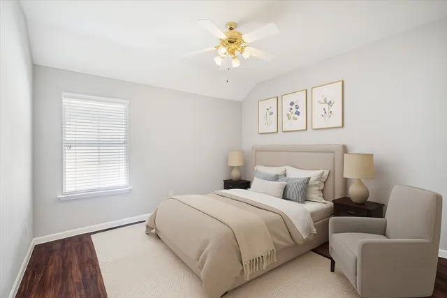 a bedroom with a bed and a couch