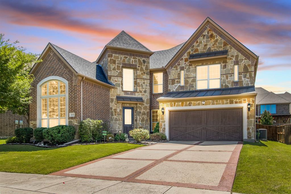 4560 Cheetah Trail Frisco, TX 75034 - Photo 1 of 38 a front view of a house with garden