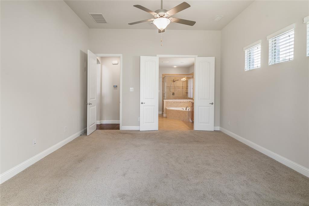 4560 Cheetah Trail Frisco, TX 75034 - Photo 11 of 38 an empty room with closet and a chandelier fan