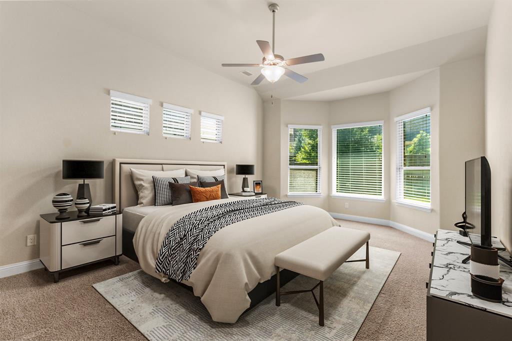 4560 Cheetah Trail Frisco, TX 75034 - Photo 2 of 38 a bedroom with a bed and a flat screen tv