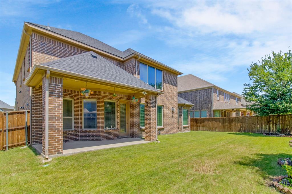 4560 Cheetah Trail Frisco, TX 75034 - Photo 36 of 38 a view of a house with a backyard
