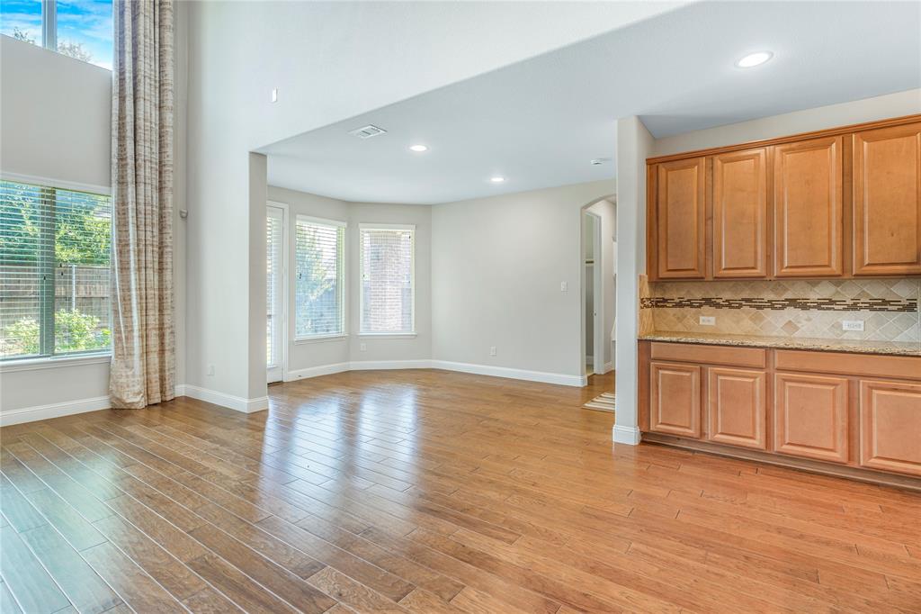 4560 Cheetah Trail Frisco, TX 75034 - Photo 8 of 38 a view of a kitchen with wooden floor and electronic appliances