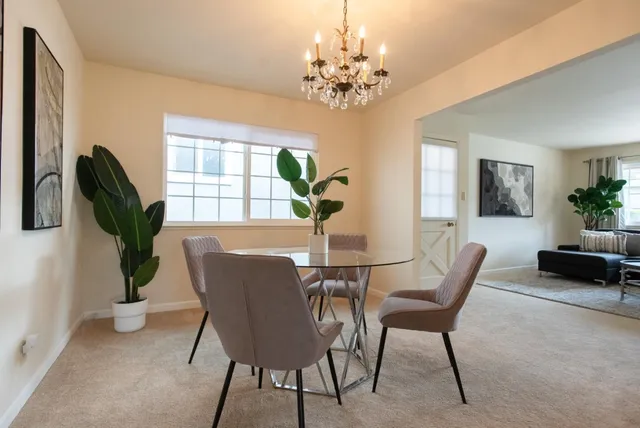 a kitchen with stainless steel appliances granite countertop wooden cabinets a stove top oven a sink and dishwasher