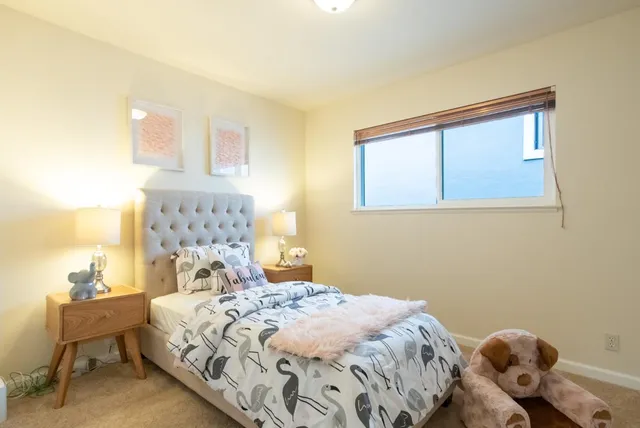 a bedroom with a bed and a table in it