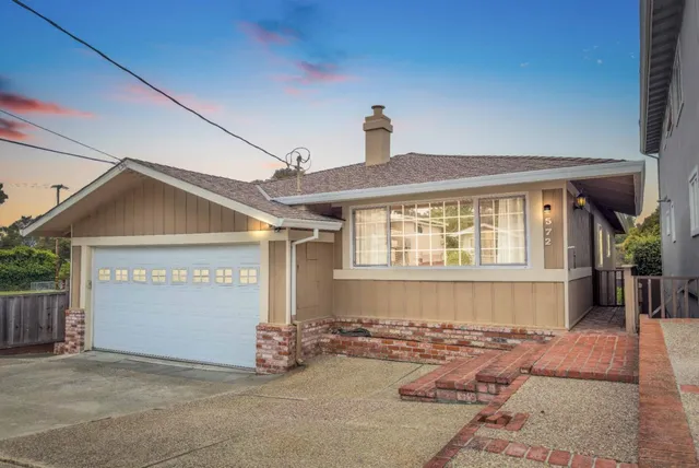a front view of a house with a garage
