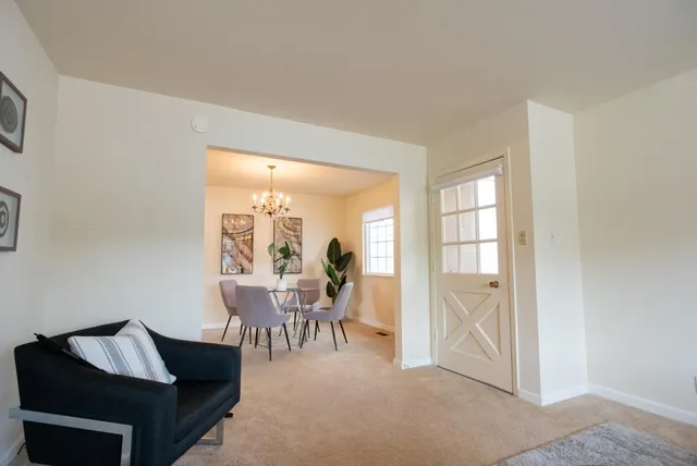 a bathroom with a granite countertop sink mirror vanity and toilet