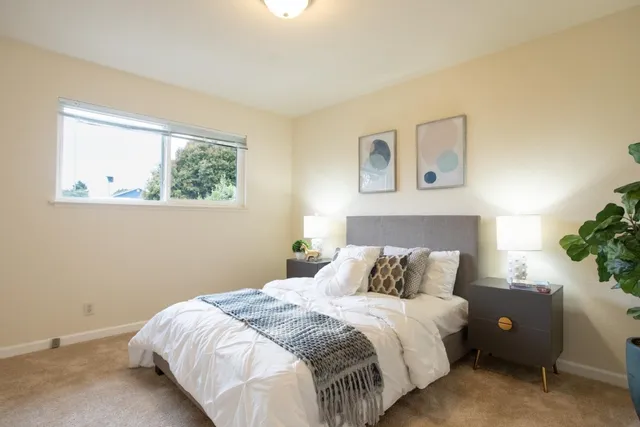 a bathroom with a glass shower door and a sink