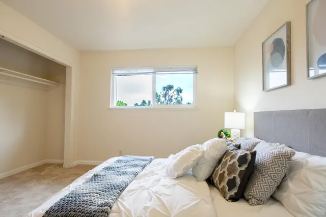 a kitchen with a refrigerator and potted plant