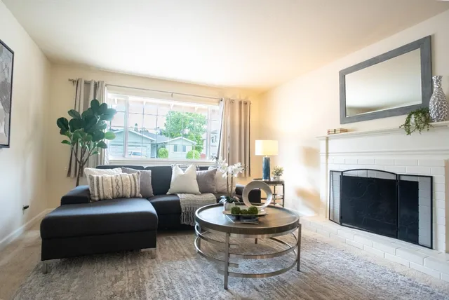 a view of a dining room with furniture and chandelier
