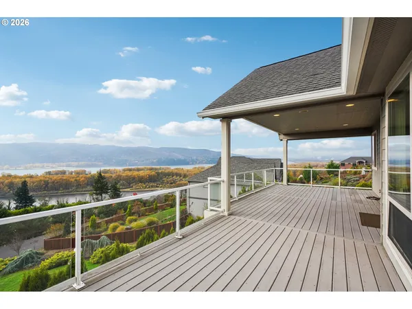 a view of a balcony with wooden floor