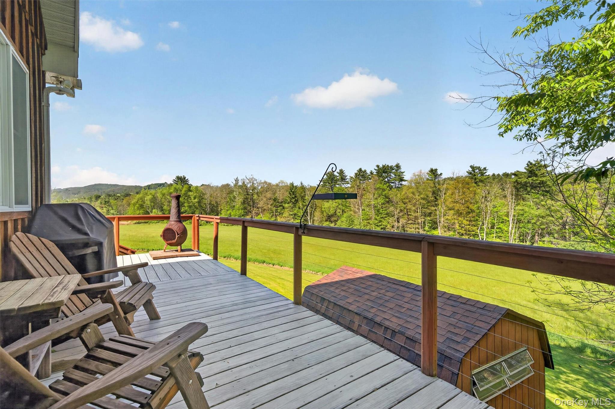 340 Hospital Road Callicoon, NY 12723 - Photo 18 of 41 a view of a balcony with lake view and wooden floor