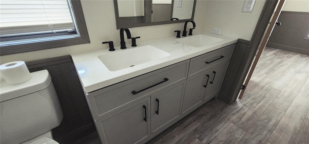 19865 Southwest 5th Place Dunnellon, FL 34431 - Photo 51 of 78 a bathroom with a sink and mirror with toilet