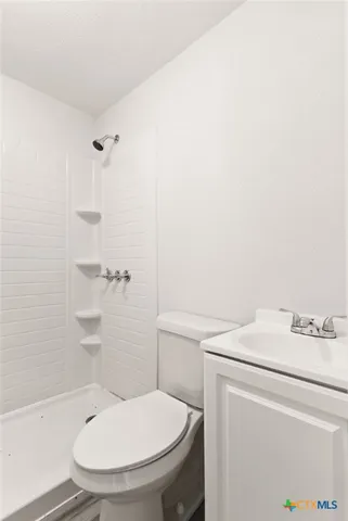 a bathroom with a toilet and a sink