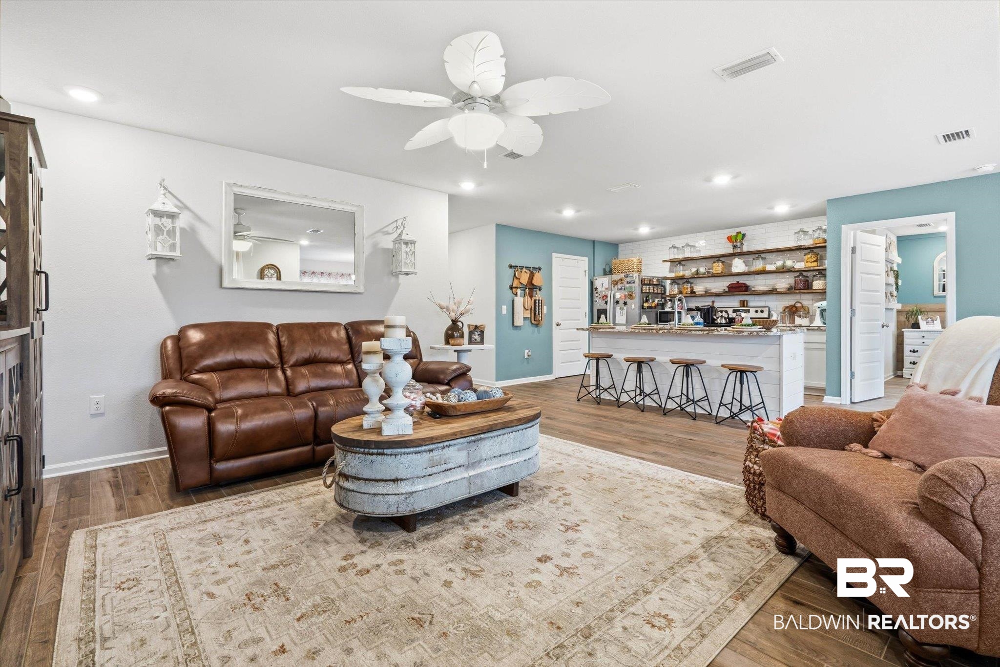 17041 Muse Street Loxley, AL 36551 - Photo 4 of 44 Living room with wood finished floors, a ceiling fan, recessed lighting, and bar