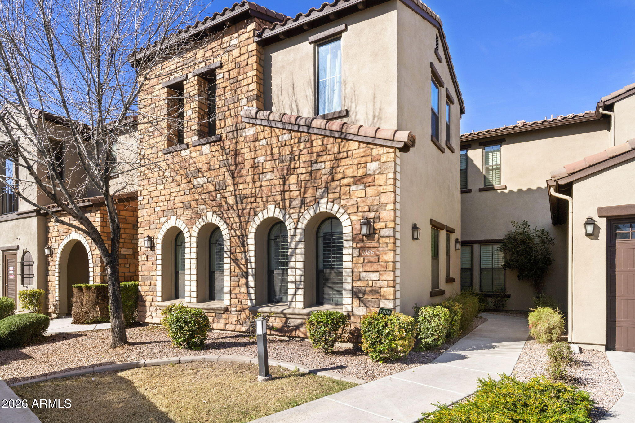 4777 South Fulton Ranch Boulevard, Unit 1086 Chandler, AZ 85248 - Photo 1 of 67 a front view of a house