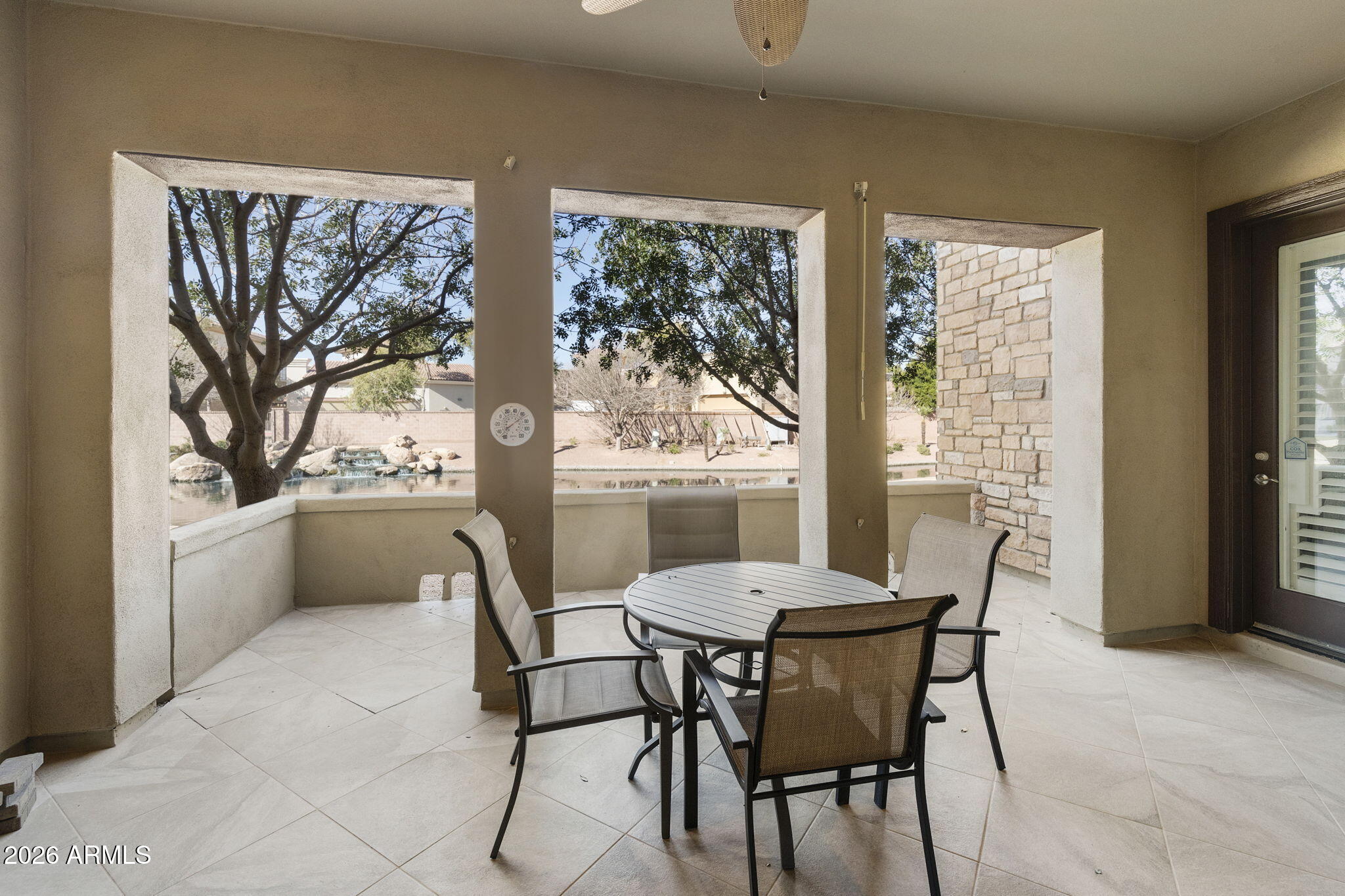 4777 South Fulton Ranch Boulevard, Unit 1086 Chandler, AZ 85248 - Photo 20 of 67 a view of a dining room with furniture large windows and wooden floor