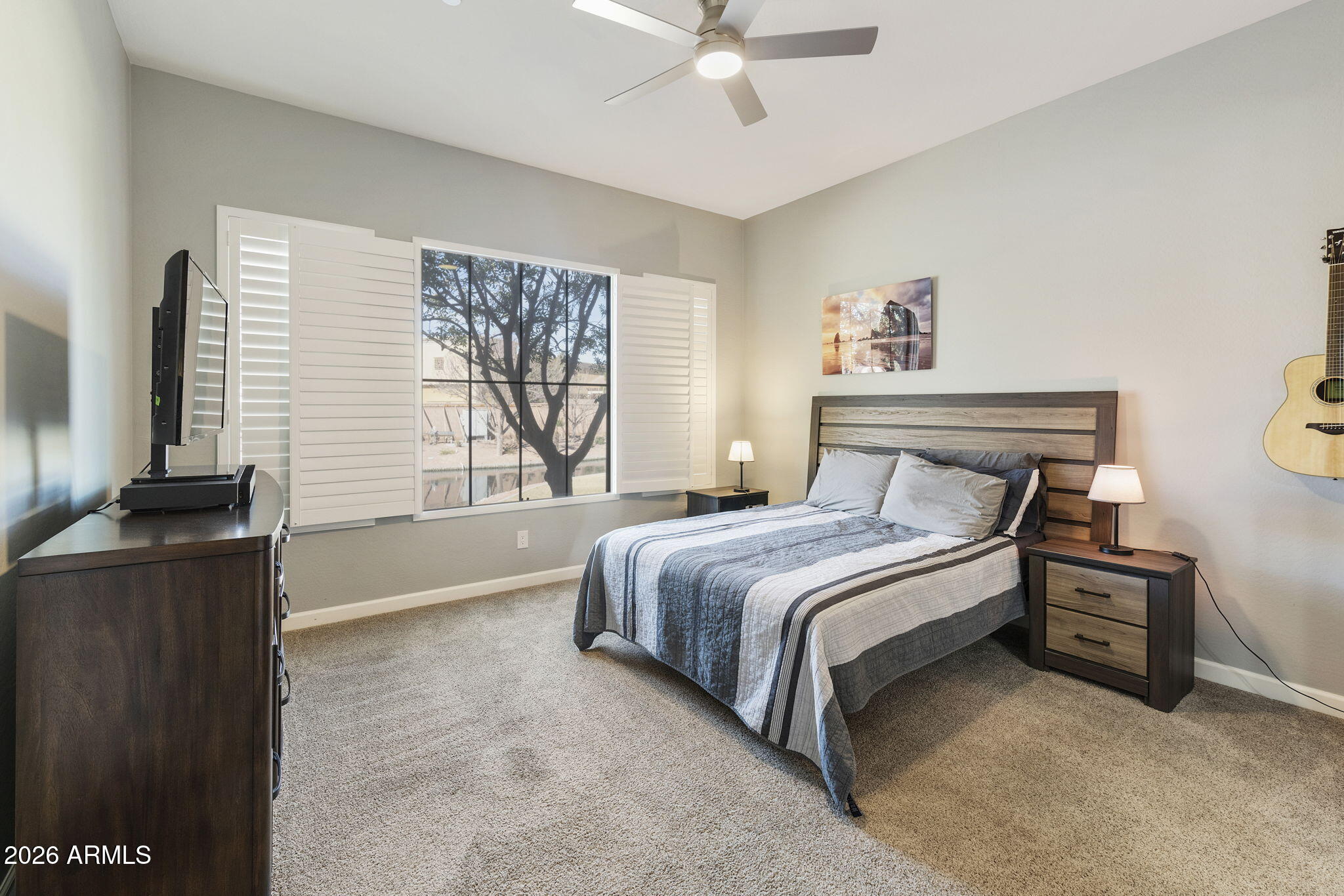 4777 South Fulton Ranch Boulevard, Unit 1086 Chandler, AZ 85248 - Photo 28 of 67 a bedroom with a bed dresser and a window