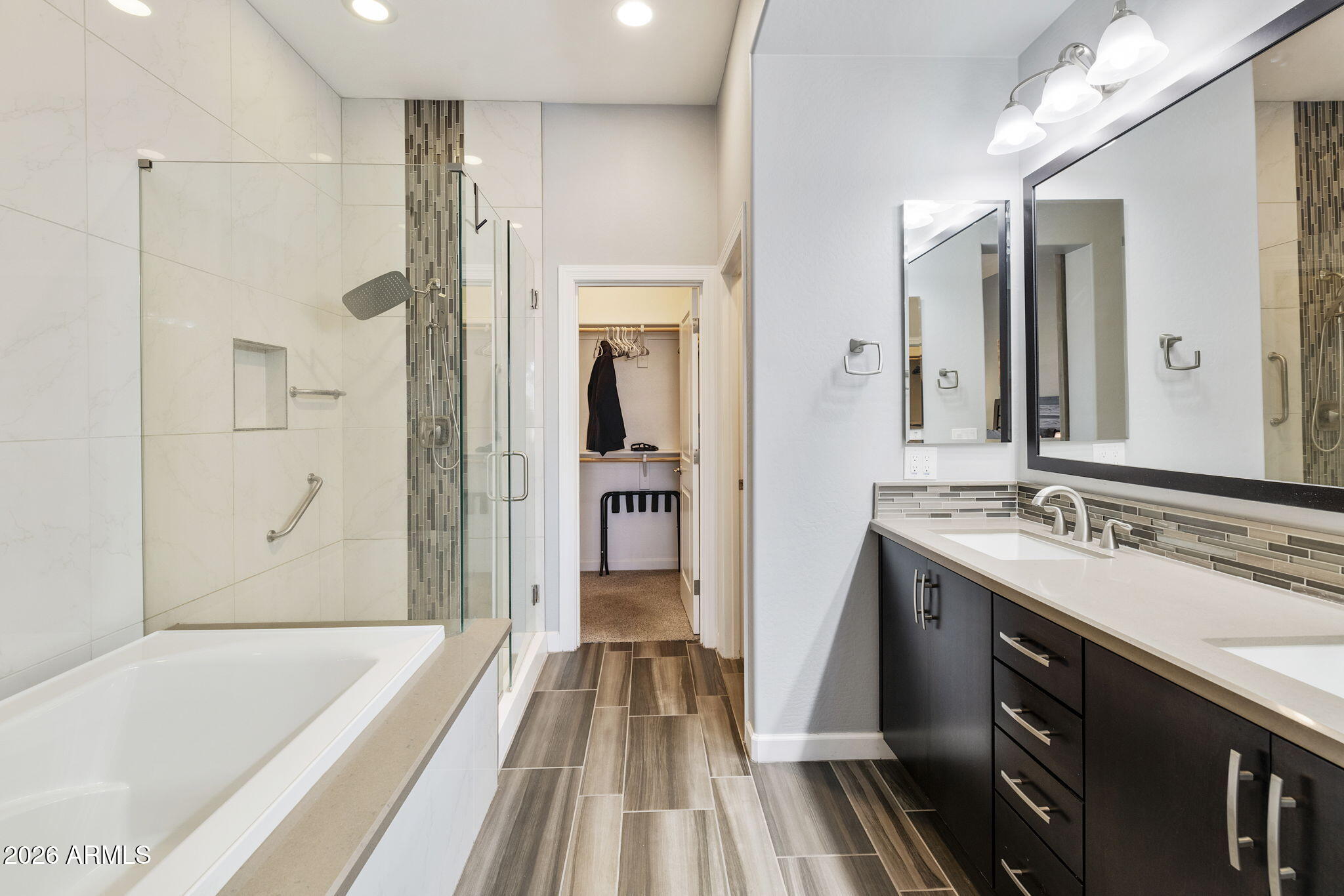 4777 South Fulton Ranch Boulevard, Unit 1086 Chandler, AZ 85248 - Photo 30 of 67 a bathroom with a bathtub and a sink
