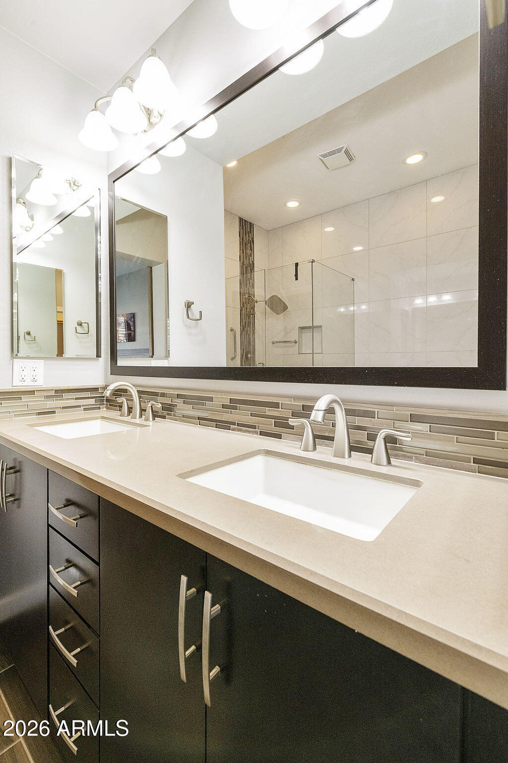 4777 South Fulton Ranch Boulevard, Unit 1086 Chandler, AZ 85248 - Photo 31 of 67 a bathroom with a sink a large mirror and vanity