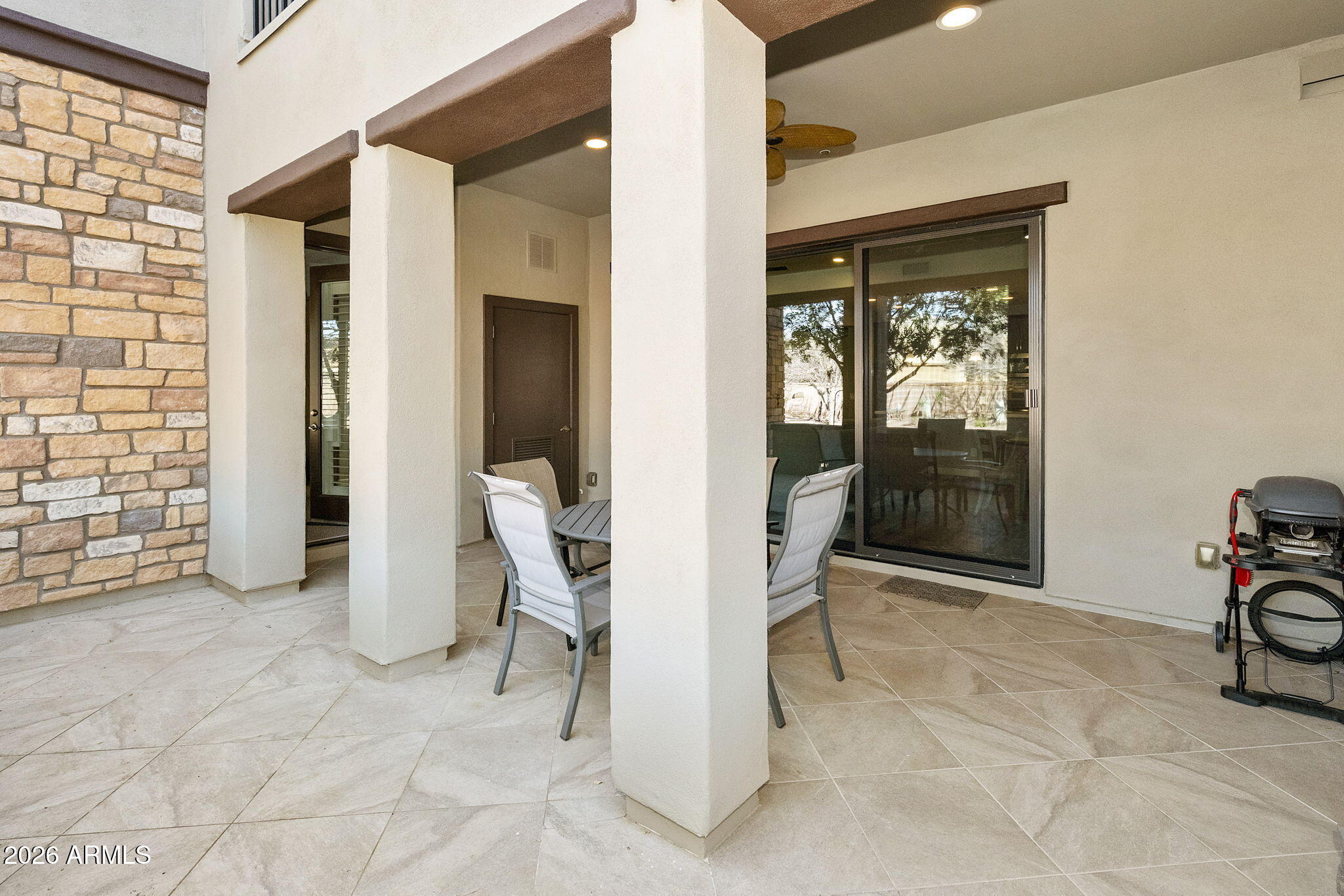4777 South Fulton Ranch Boulevard, Unit 1086 Chandler, AZ 85248 - Photo 37 of 67 a view of a patio with table and chairs and potted plants
