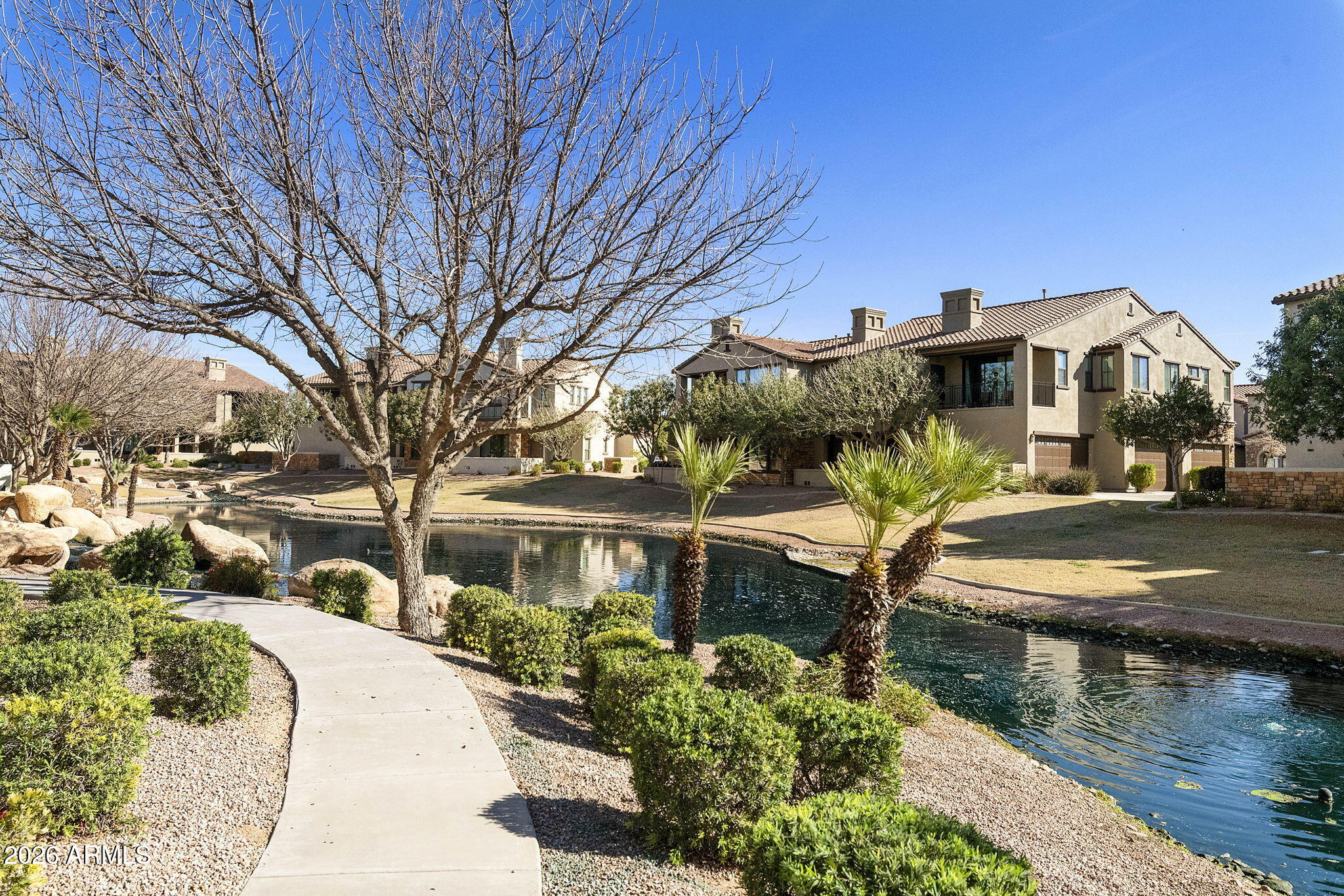 4777 South Fulton Ranch Boulevard, Unit 1086 Chandler, AZ 85248 - Photo 41 of 67 a front view of a house with a yard