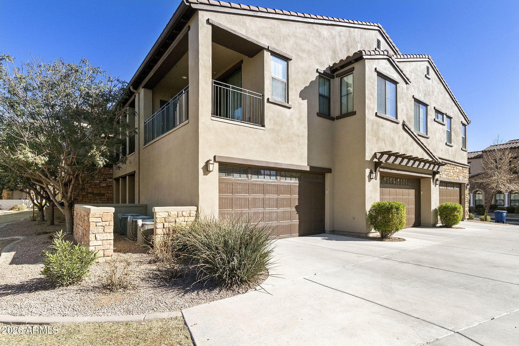 4777 South Fulton Ranch Boulevard, Unit 1086 Chandler, AZ 85248 - Photo 45 of 67 a front view of a house with a yard