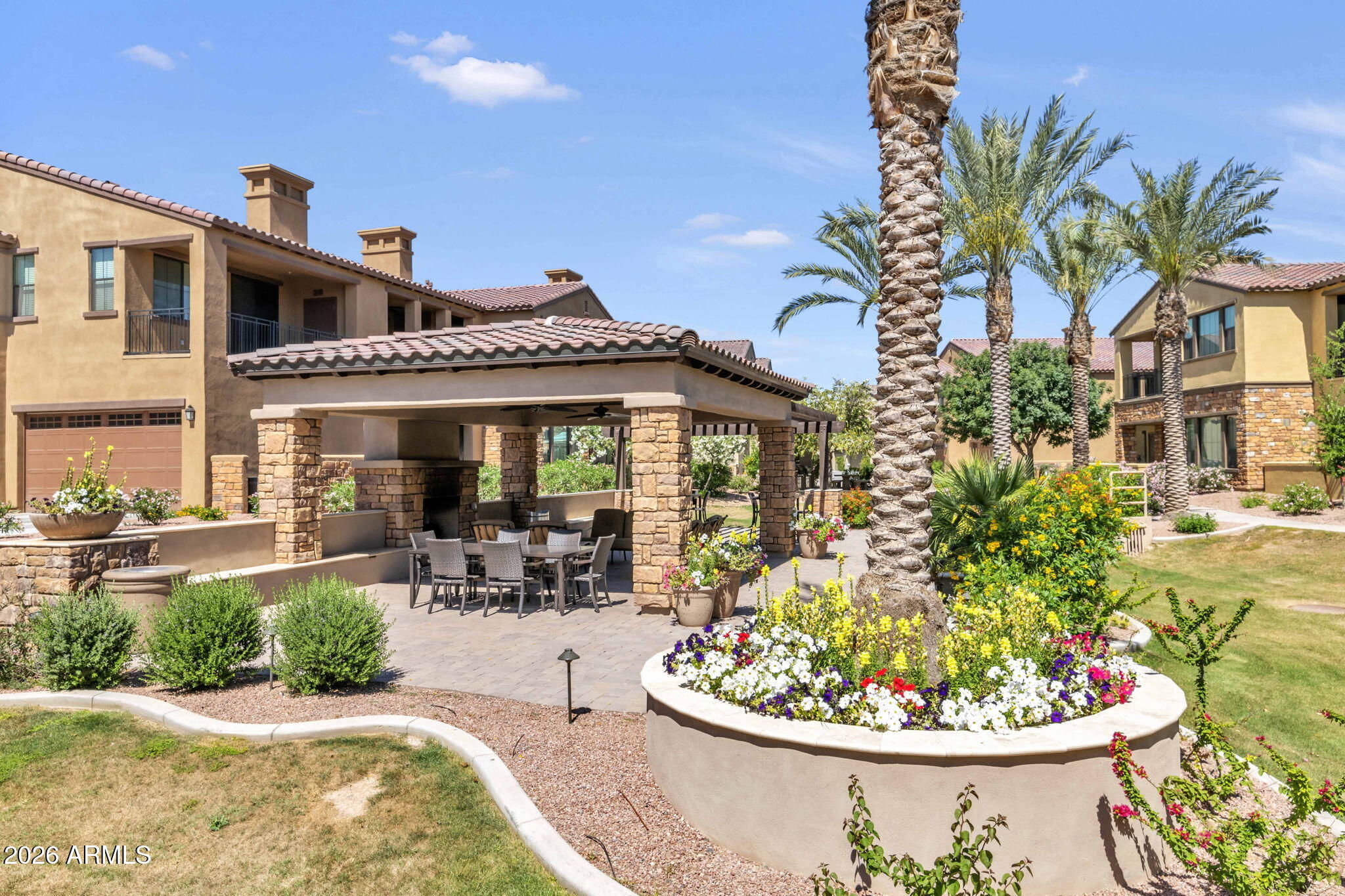 4777 South Fulton Ranch Boulevard, Unit 1086 Chandler, AZ 85248 - Photo 48 of 67 a view of a white house with a swimming pool and sitting space