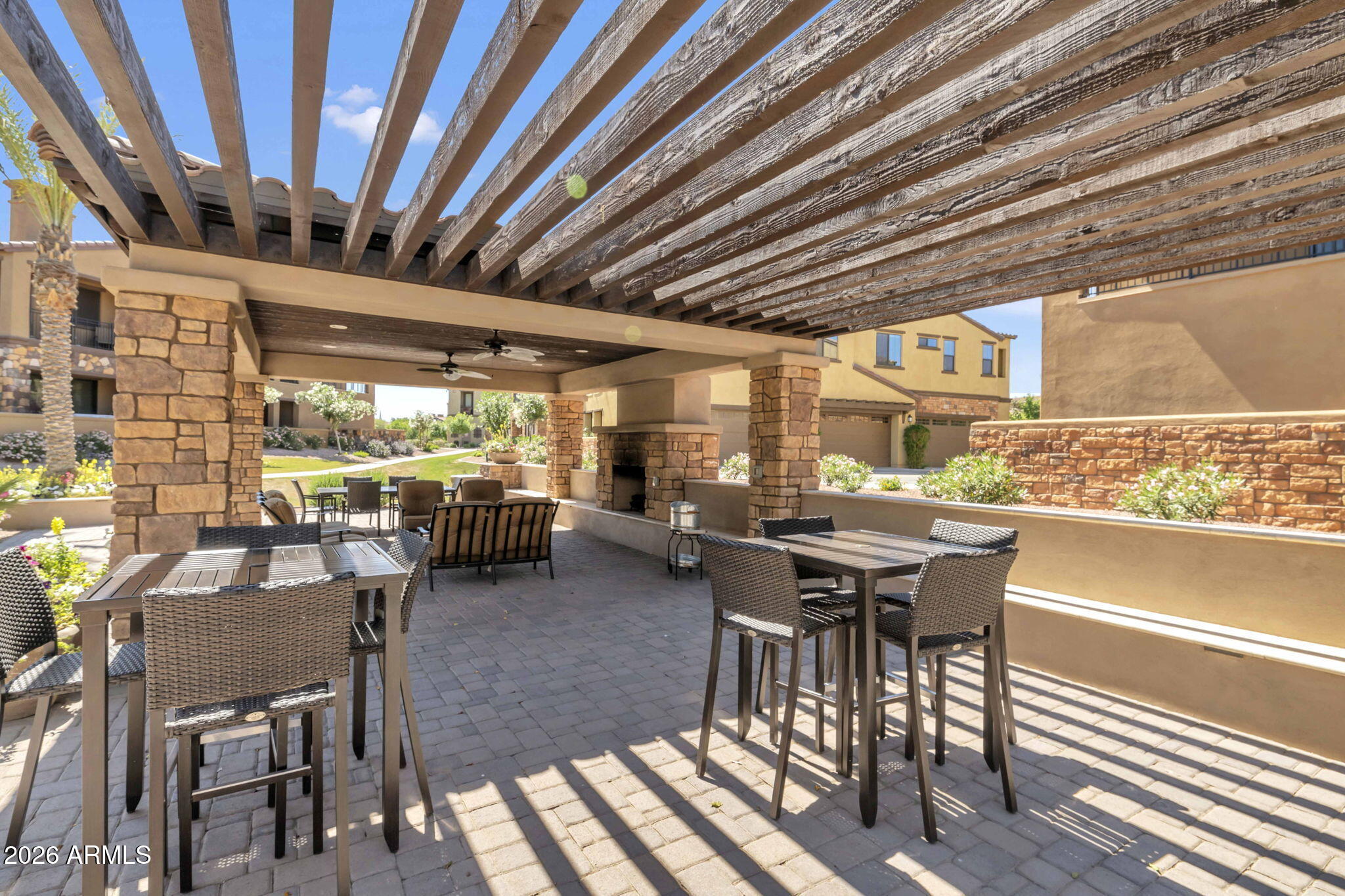 4777 South Fulton Ranch Boulevard, Unit 1086 Chandler, AZ 85248 - Photo 52 of 67 a view of a patio with table and chairs and potted plants
