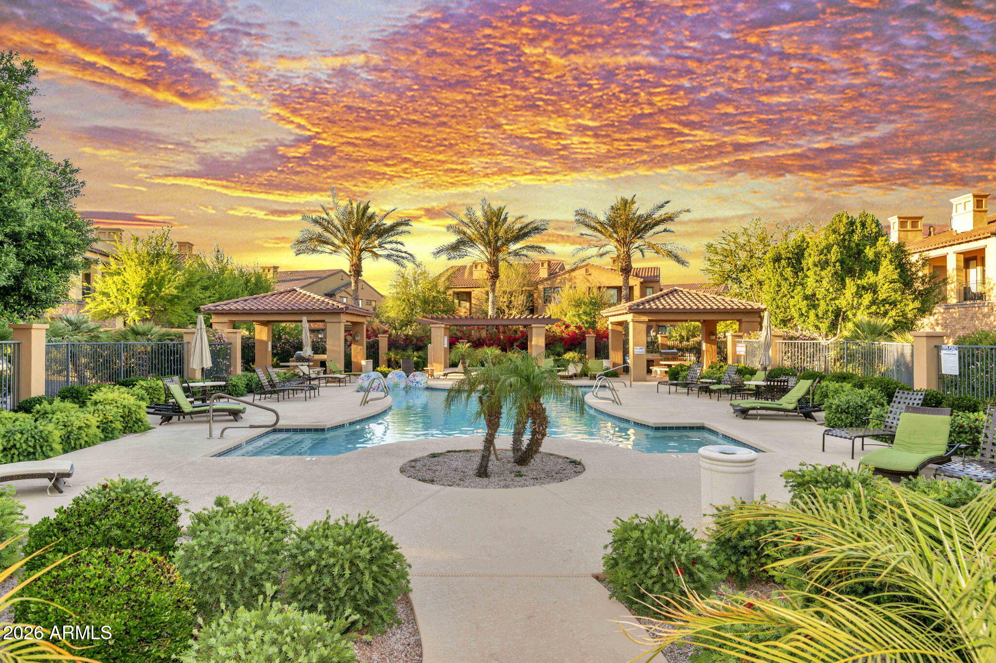 4777 South Fulton Ranch Boulevard, Unit 1086 Chandler, AZ 85248 - Photo 56 of 67 a front view of a building with garden and trees