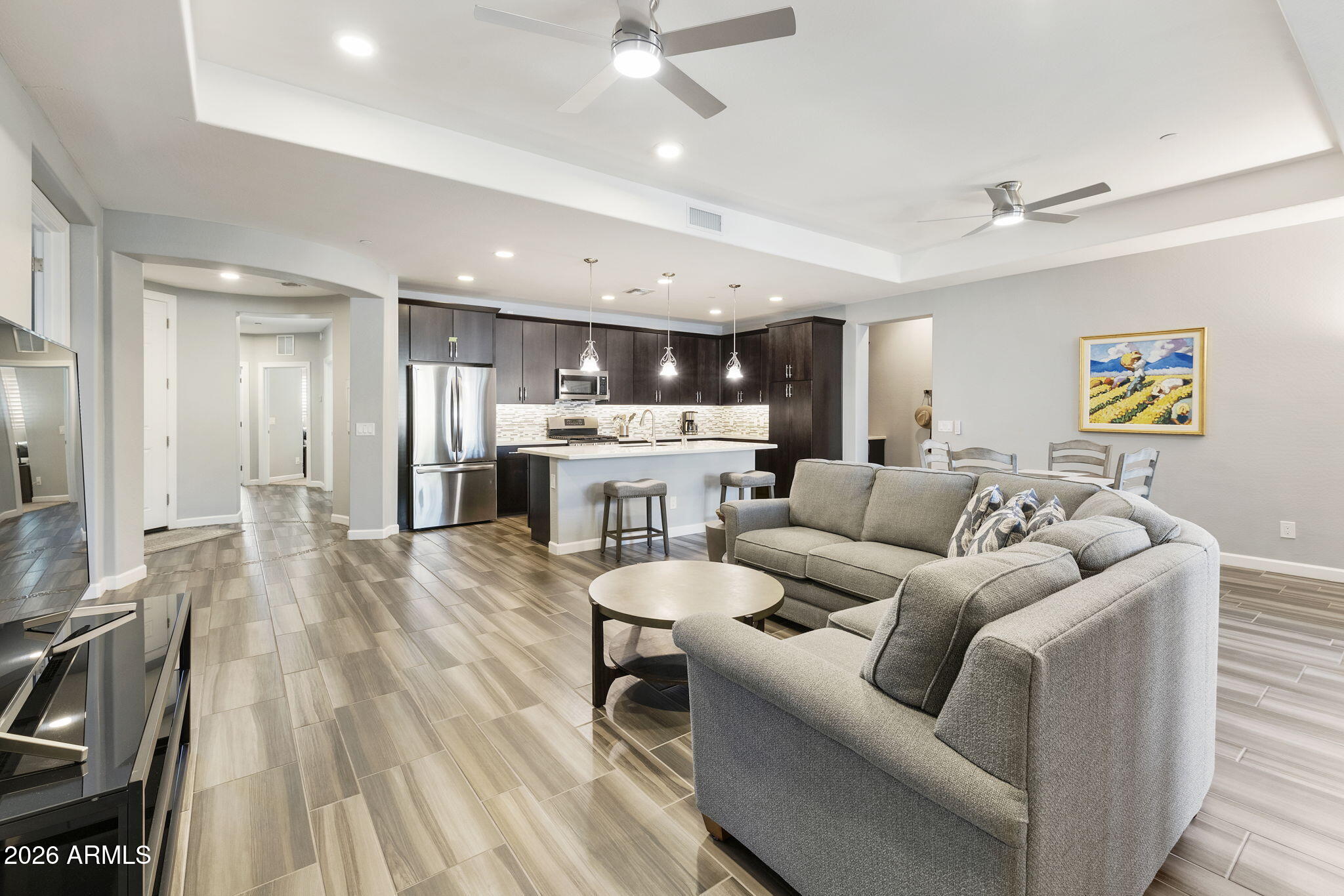 4777 South Fulton Ranch Boulevard, Unit 1086 Chandler, AZ 85248 - Photo 6 of 67 a living room with furniture and kitchen view