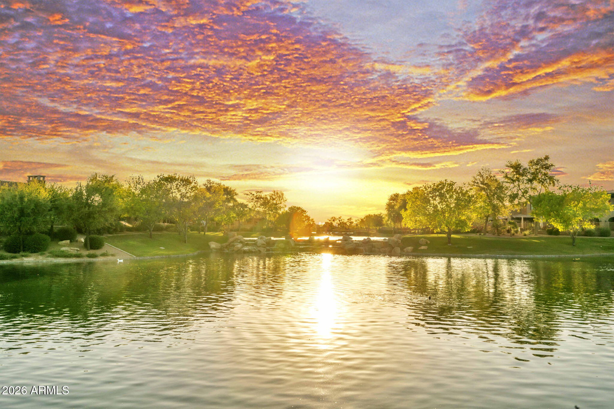 4777 South Fulton Ranch Boulevard, Unit 1086 Chandler, AZ 85248 - Photo 64 of 67 a view of a lake with houses