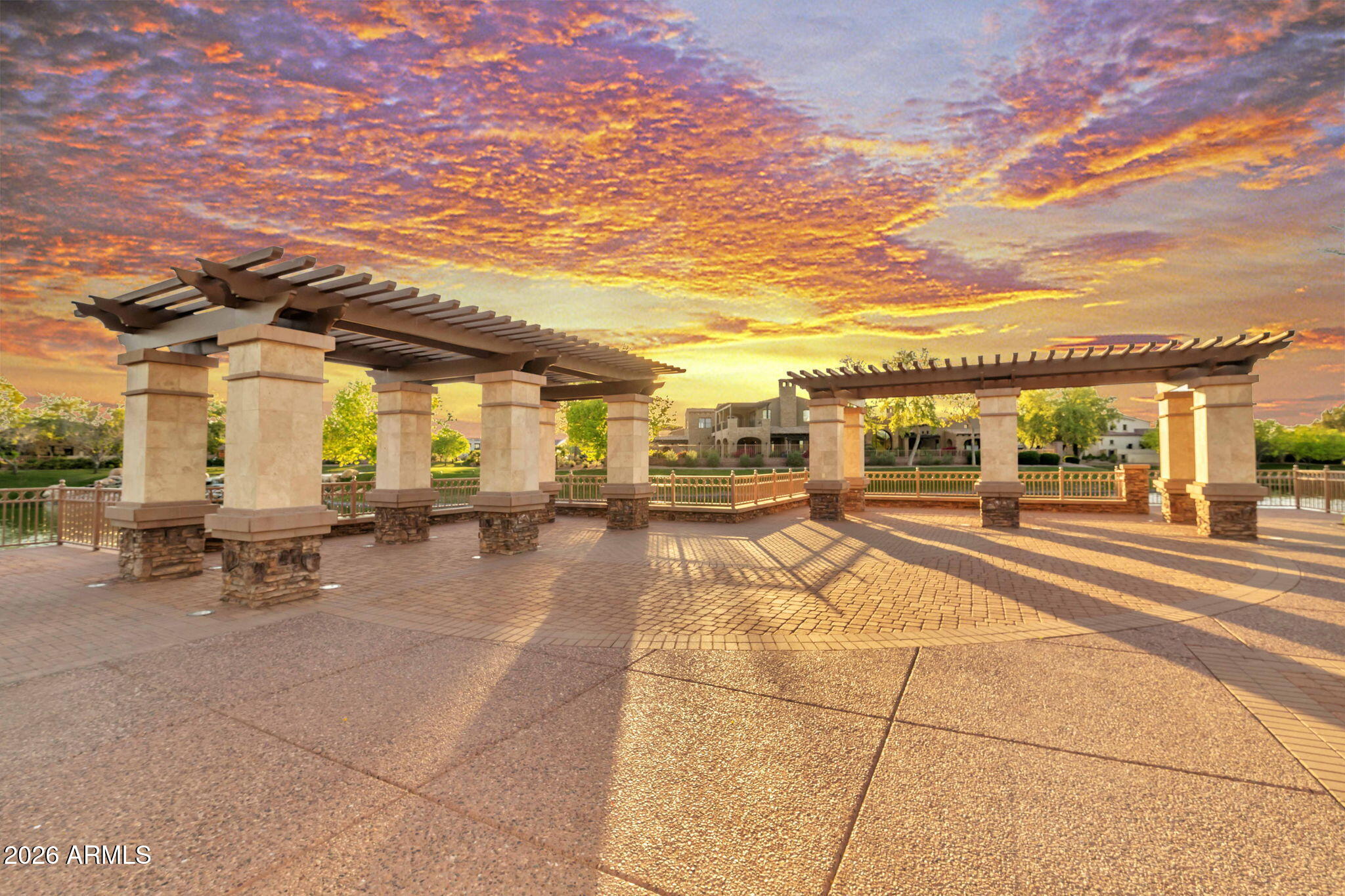 4777 South Fulton Ranch Boulevard, Unit 1086 Chandler, AZ 85248 - Photo 65 of 67 a view of a patio with table and chairs with wooden floor and fence