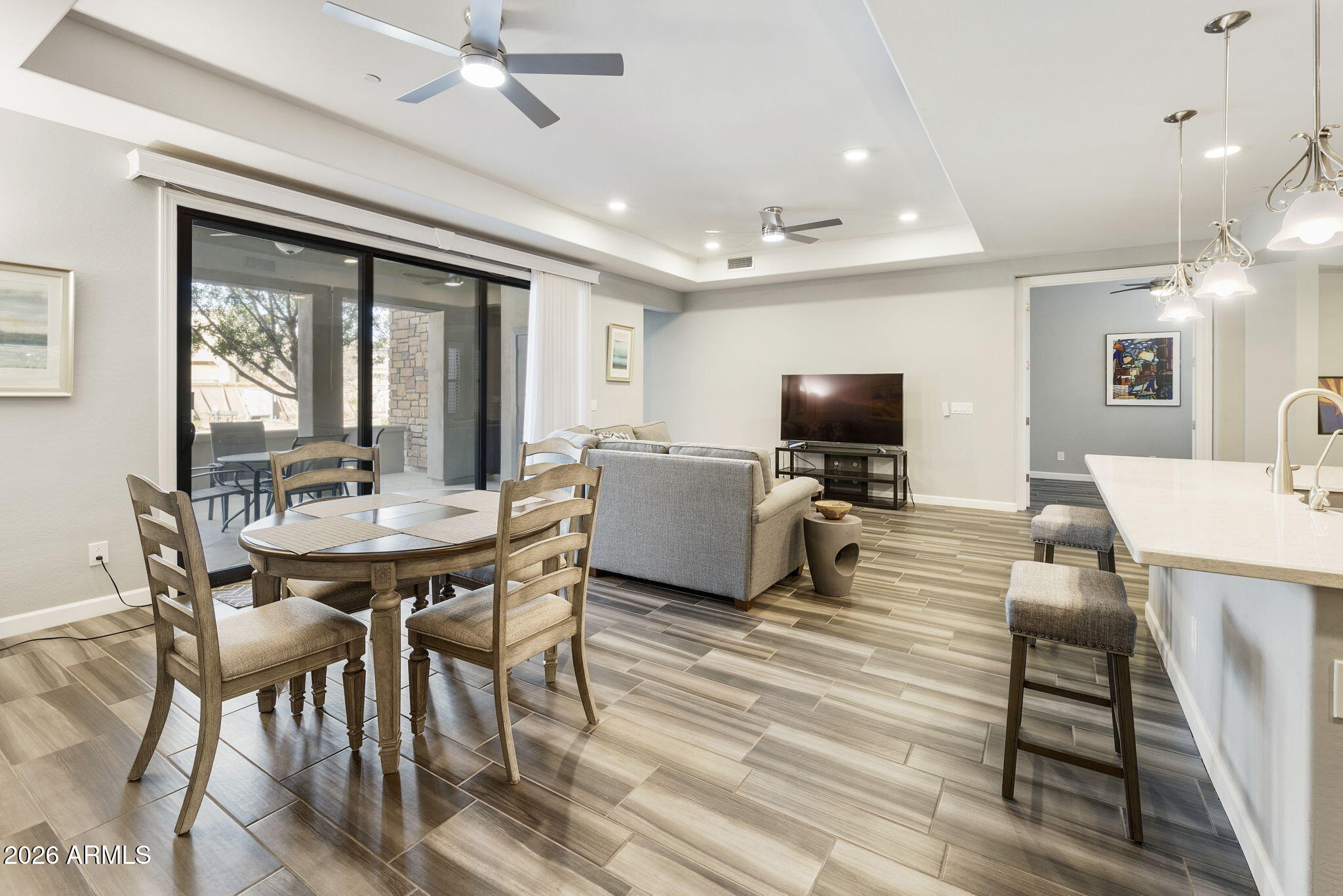 4777 South Fulton Ranch Boulevard, Unit 1086 Chandler, AZ 85248 - Photo 8 of 67 a view of a dining room with furniture window and wooden floor