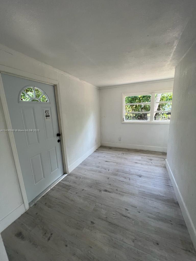 5836 Hope Street Hollywood, FL 33021 - Photo 12 of 24 an empty room with windows