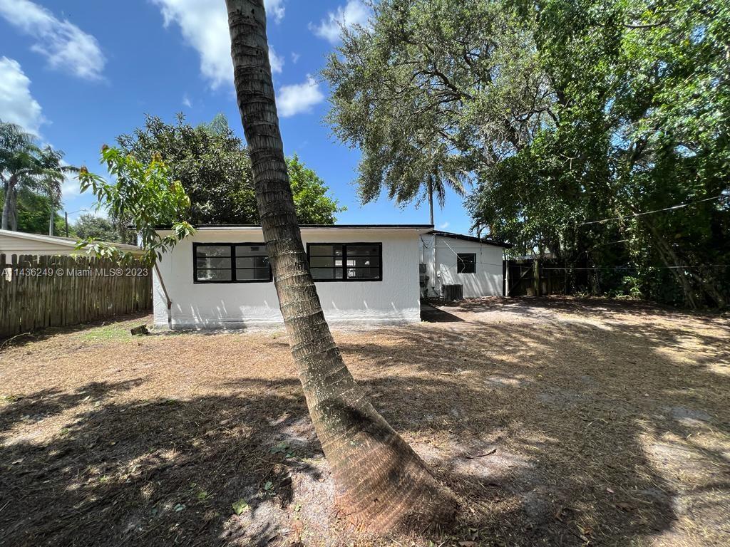5836 Hope Street Hollywood, FL 33021 - Photo 24 of 24 a front view of a house with a yard and garage
