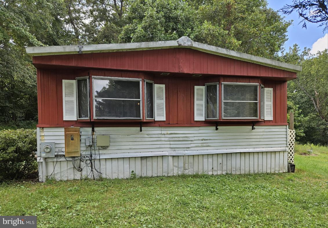 15690 Nelson Perrie Road Brandywine, MD 20613 - Photo 3 of 5 a view of a house with a yard