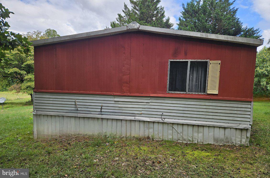 15690 Nelson Perrie Road Brandywine, MD 20613 - Photo 4 of 5 a view of a house with a yard