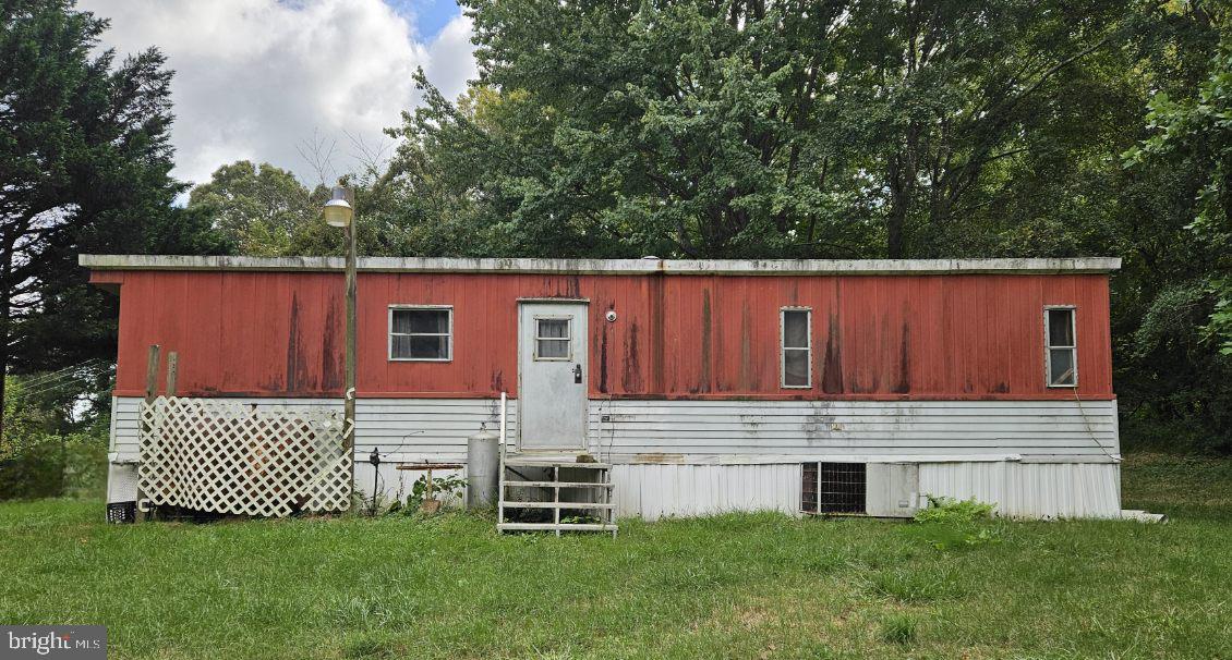 15690 Nelson Perrie Road Brandywine, MD 20613 - Photo 5 of 5 a view of a house with a yard