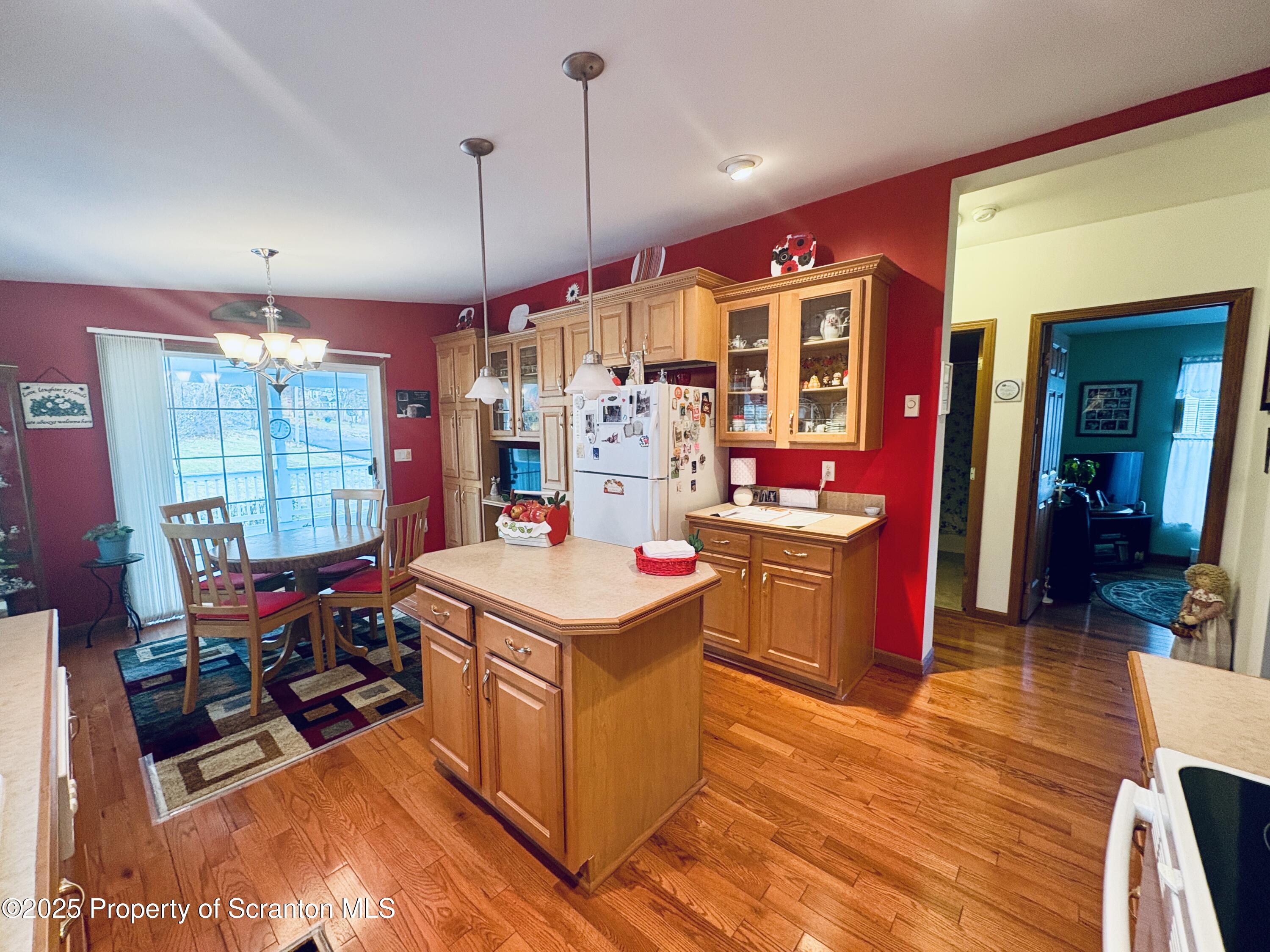813 Poplar Street Clarks Summit, PA 18411 - Photo 13 of 33 a kitchen that has a lot of cabinets and wooden floor