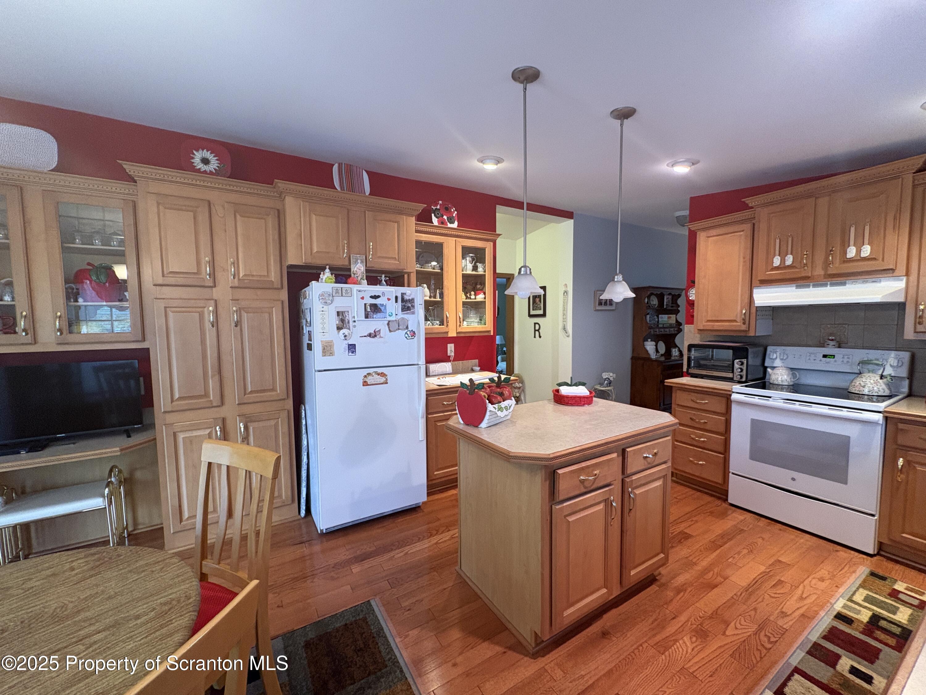 813 Poplar Street Clarks Summit, PA 18411 - Photo 14 of 33 a kitchen that has a lot of white cabinets and stainless steel appliances