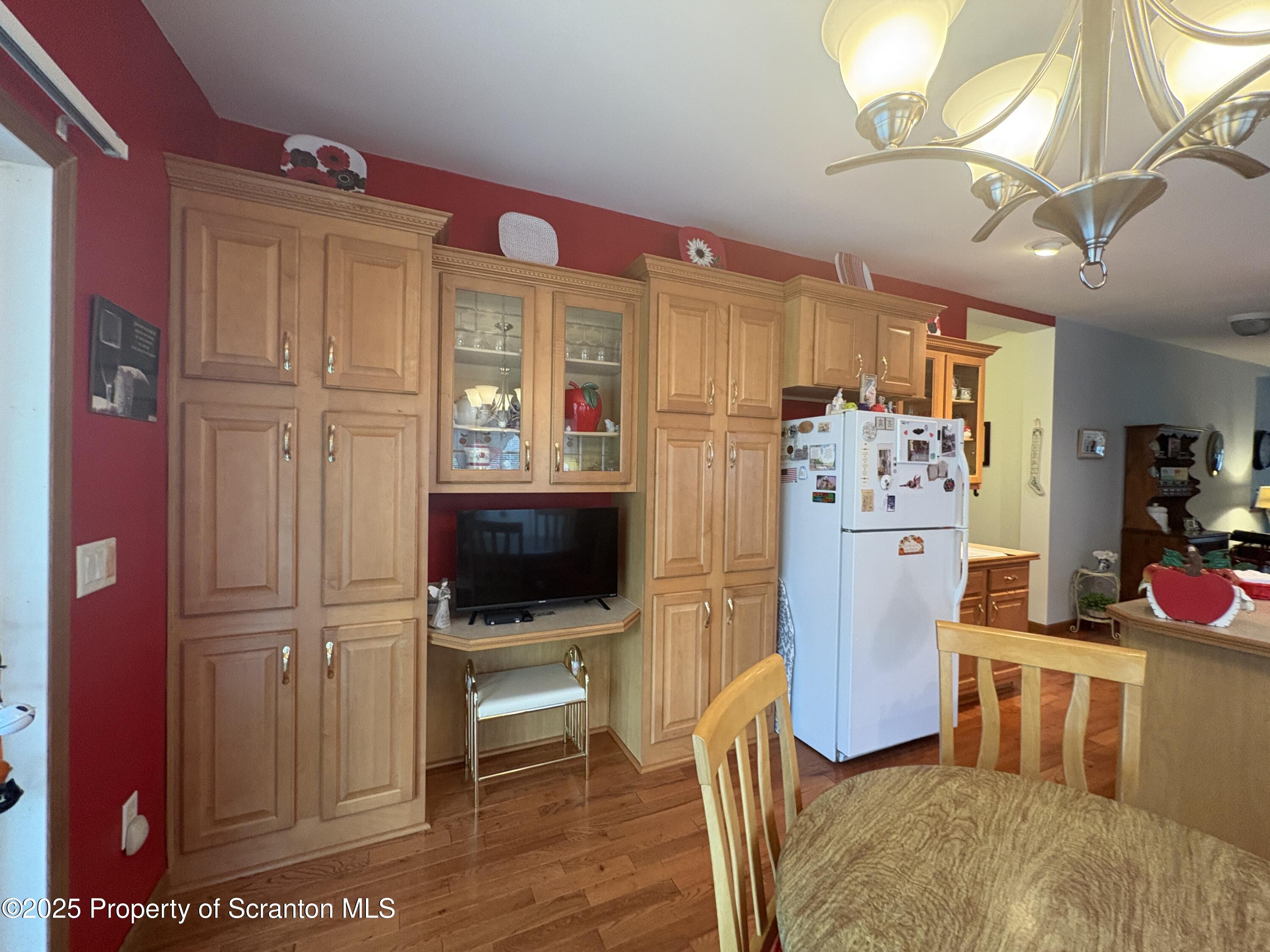 813 Poplar Street Clarks Summit, PA 18411 - Photo 15 of 33 a living room with furniture a flat screen tv and kitchen view
