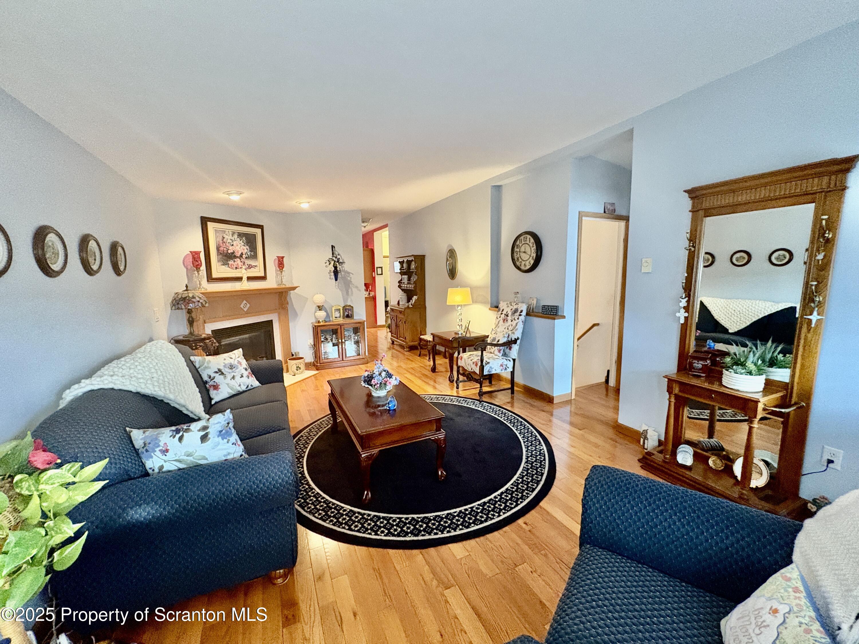 813 Poplar Street Clarks Summit, PA 18411 - Photo 2 of 33 a living room with furniture a rug and a window