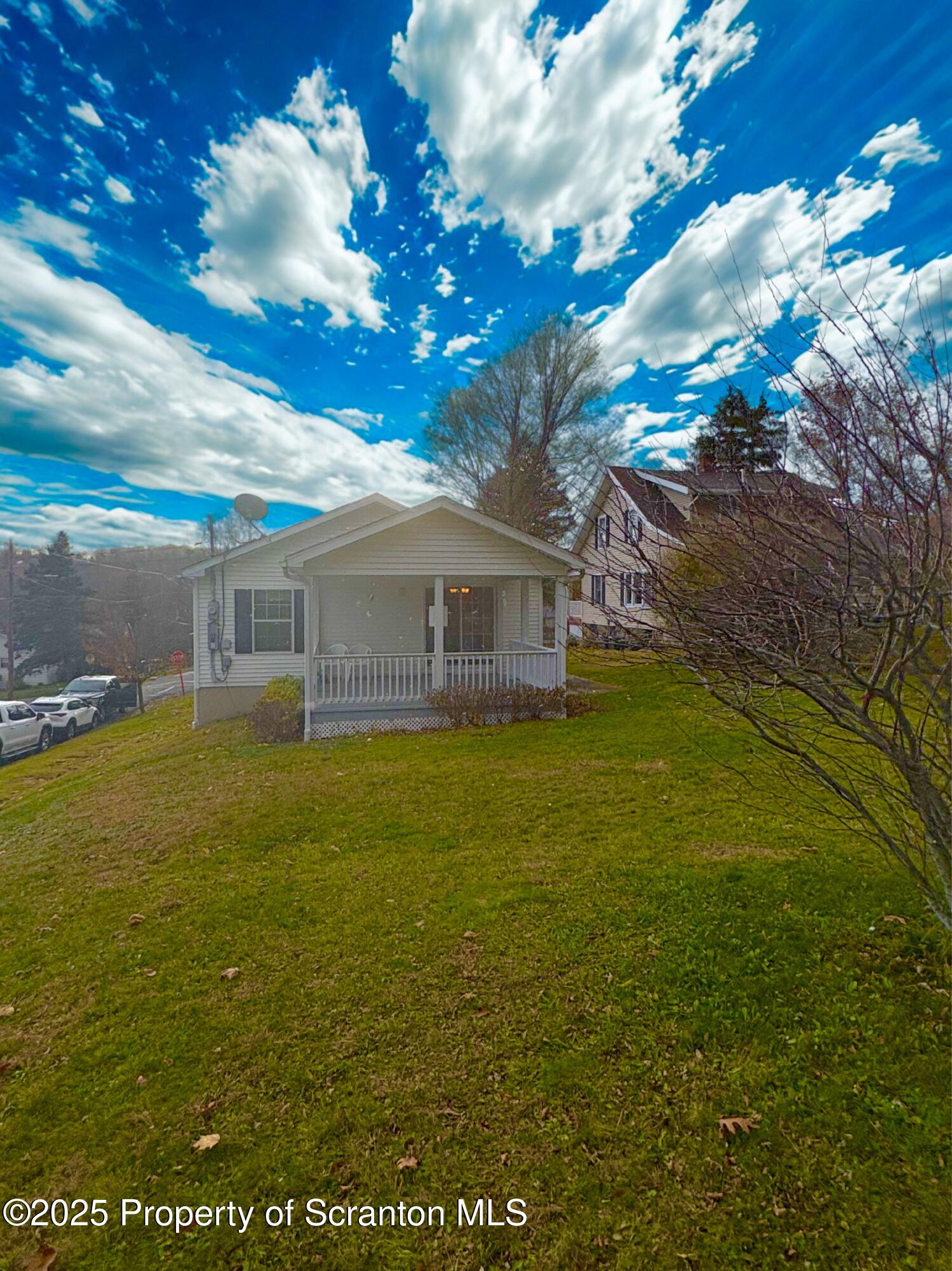 813 Poplar Street Clarks Summit, PA 18411 - Photo 26 of 33 a front view of a house with a big yard