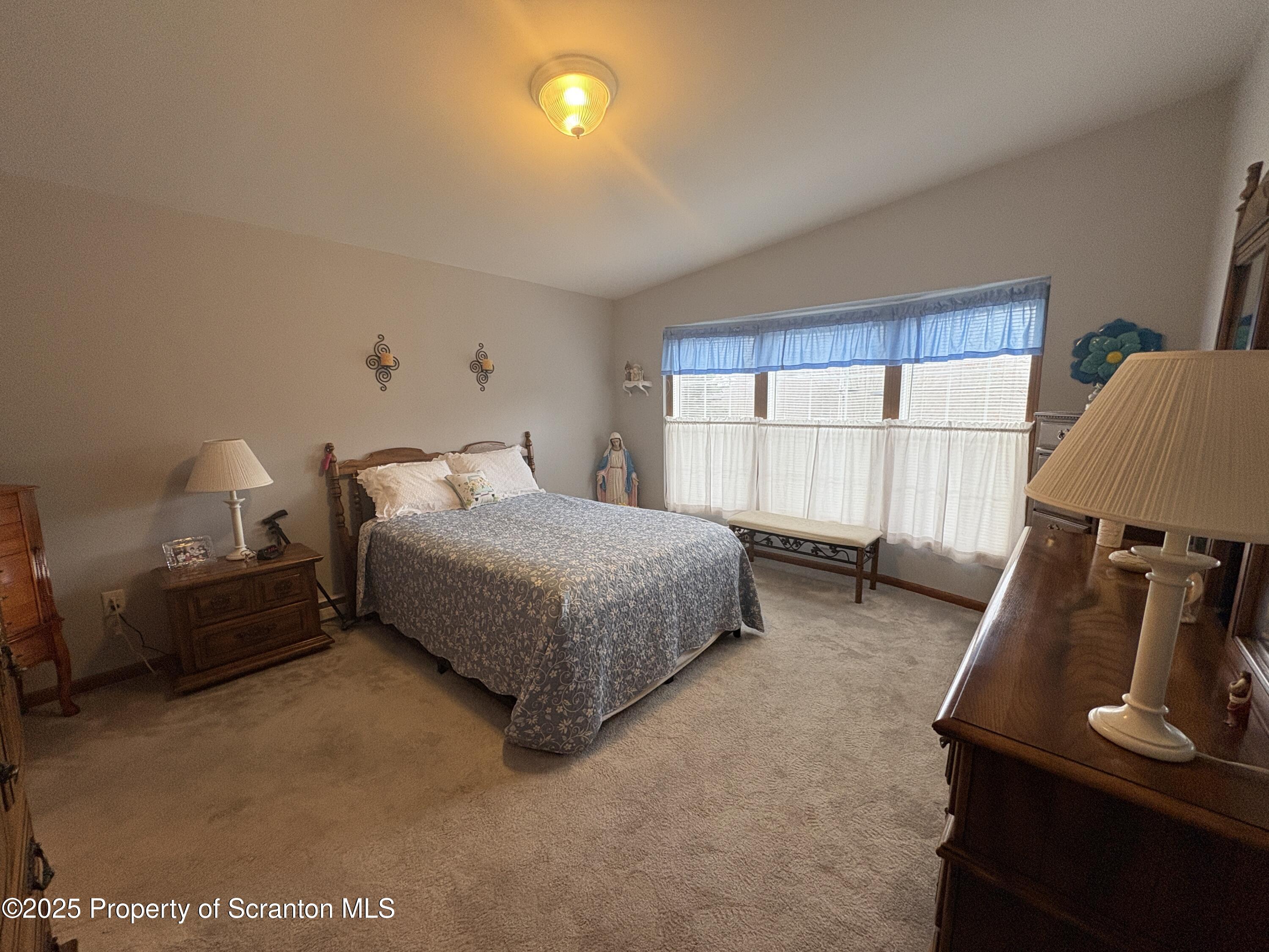 813 Poplar Street Clarks Summit, PA 18411 - Photo 10 of 33 a bedroom with bed and window