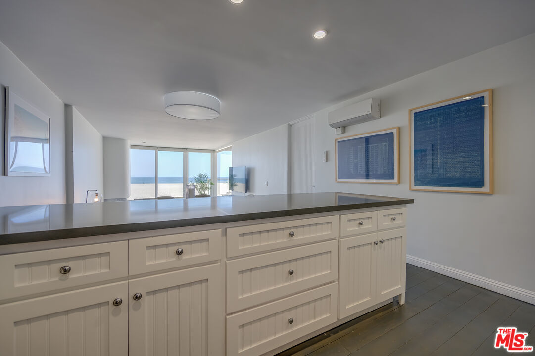 2 Ketch Street, Unit 107 Marina del Rey, CA 90292 - Photo 15 of 23 a kitchen with white cabinets and sink
