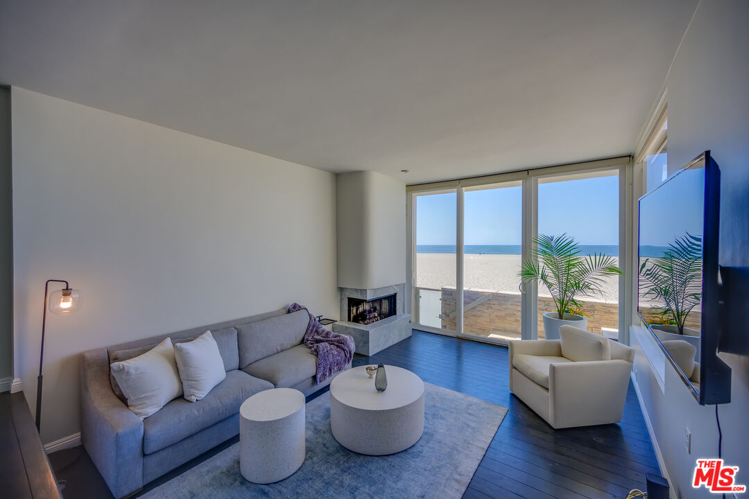 2 Ketch Street, Unit 107 Marina del Rey, CA 90292 - Photo 6 of 23 a living room with furniture potted plant and a large window