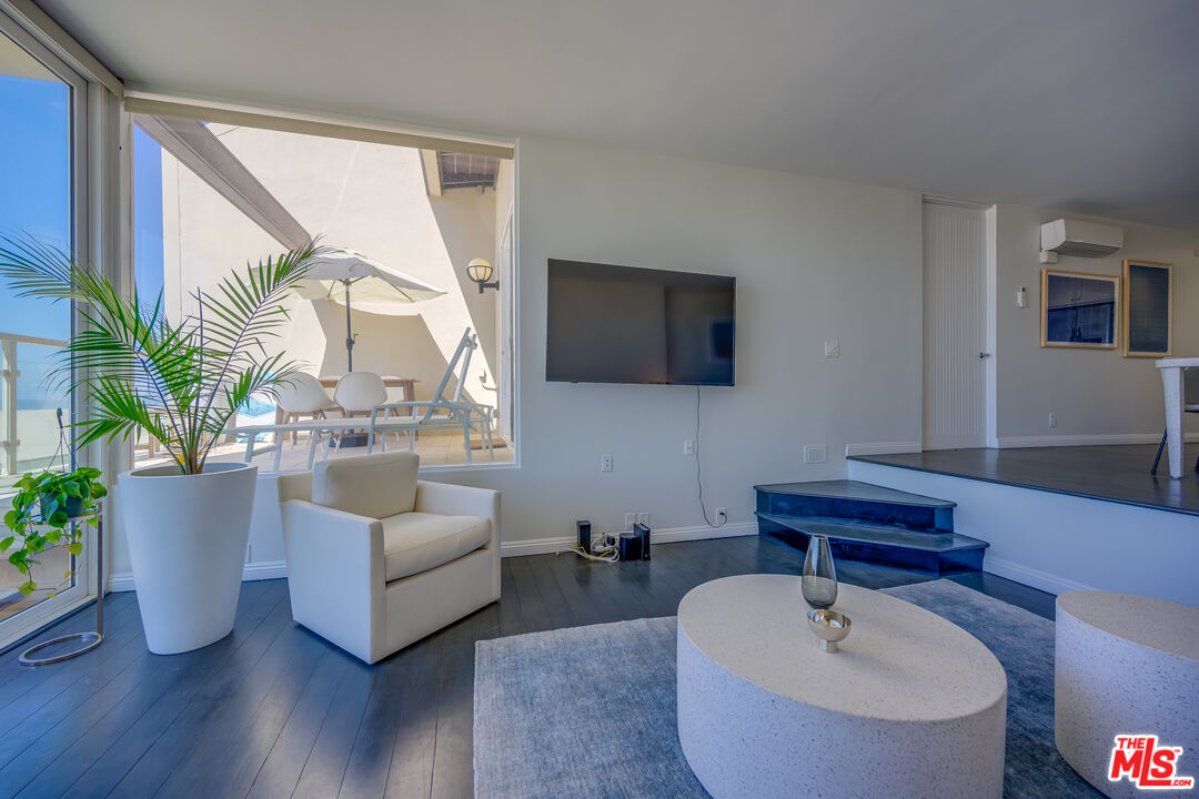 2 Ketch Street, Unit 107 Marina del Rey, CA 90292 - Photo 8 of 23 a living room with furniture and a flat screen tv